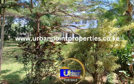 2.4 Acres in the heart of old nyali greenwood with 3 house units